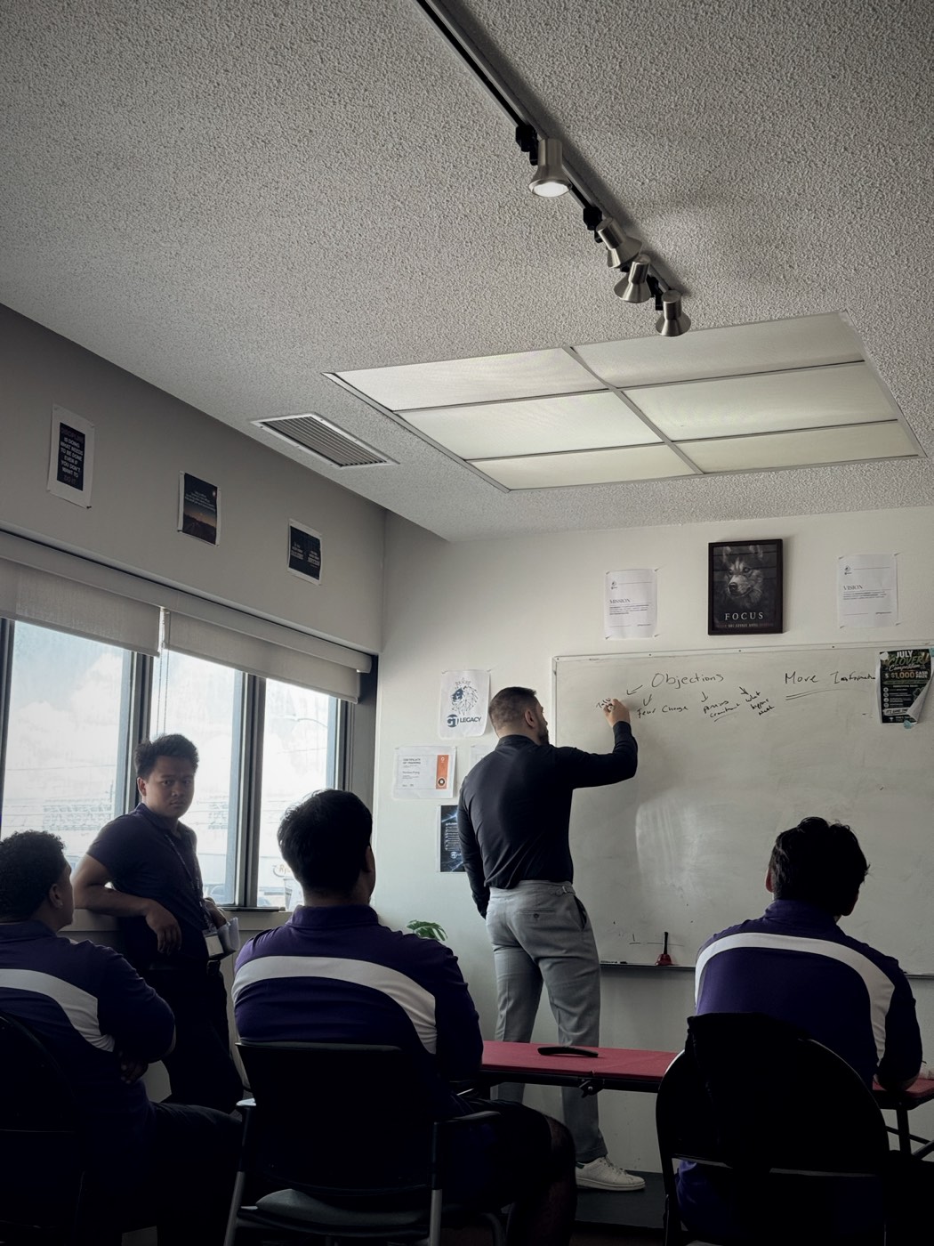 A GT Legacy leader training a group of representatives in the North York office